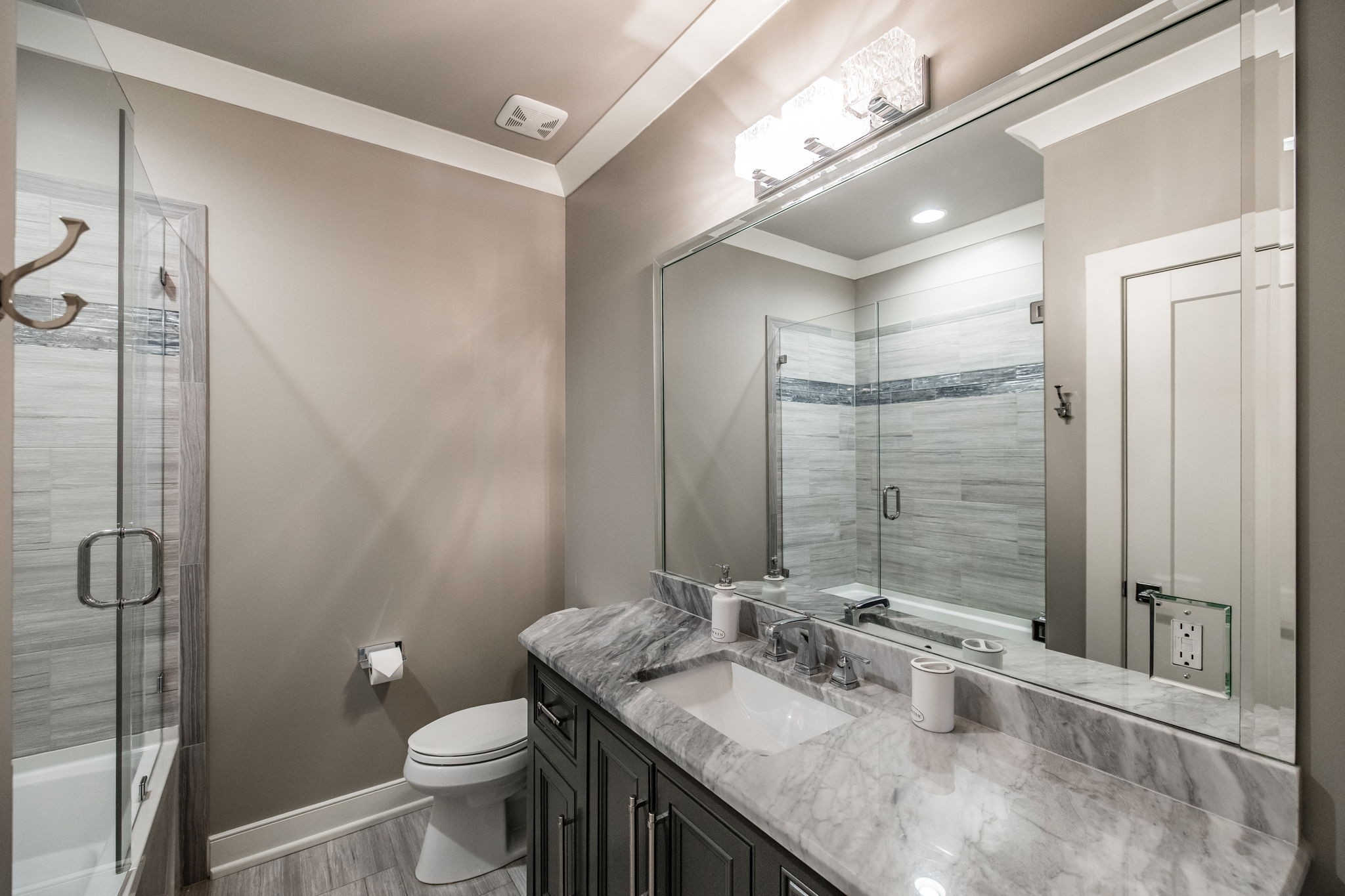1032 Kendras Run Gallatin, TN 37066 - Photo 32 of 48 a bathroom with a granite countertop sink toilet and shower