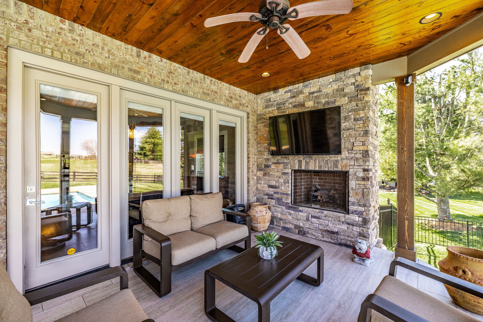 1032 Kendras Run Gallatin, TN 37066 - Photo 41 of 48 a living room with furniture a flat screen tv and a fireplace
