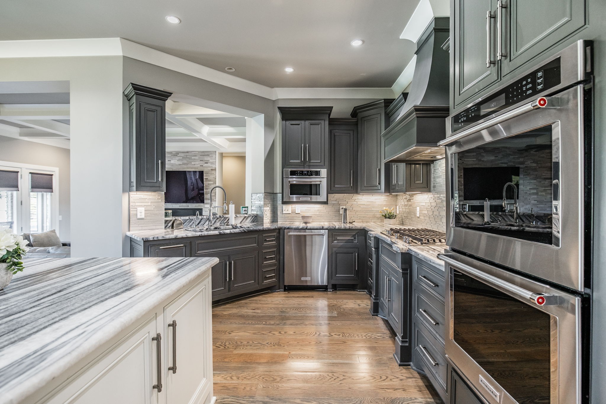 1032 Kendras Run Gallatin, TN 37066 - Photo 8 of 48 a large kitchen with stainless steel appliances granite countertop a stove top oven a sink dishwasher and white cabinets