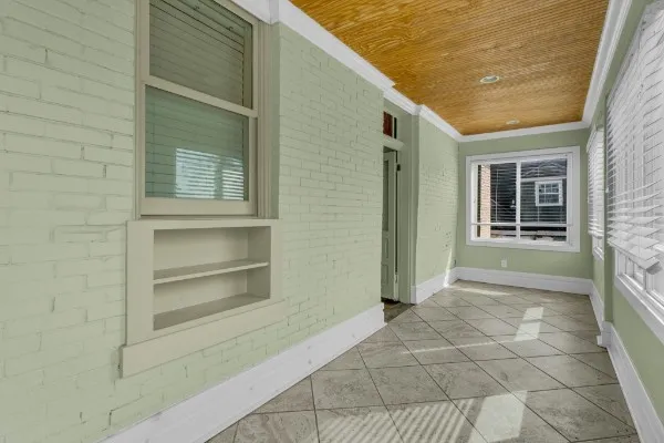 a view of a backyard with wooden fence