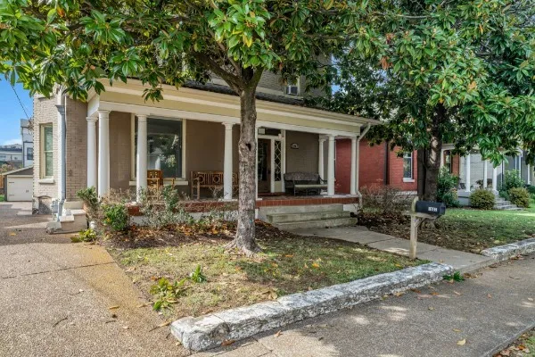 a front view of a house with garden