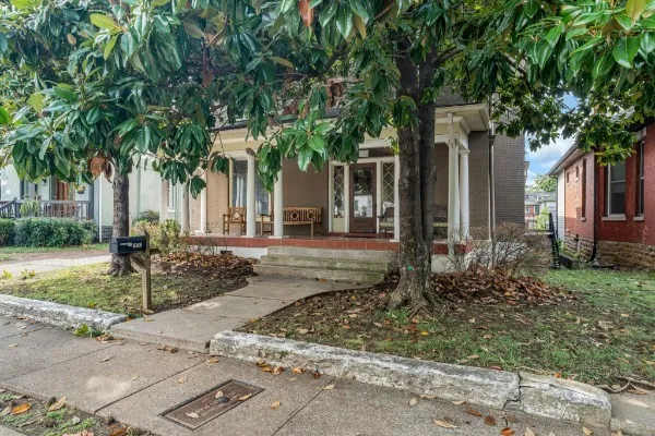 a front view of a house with garden