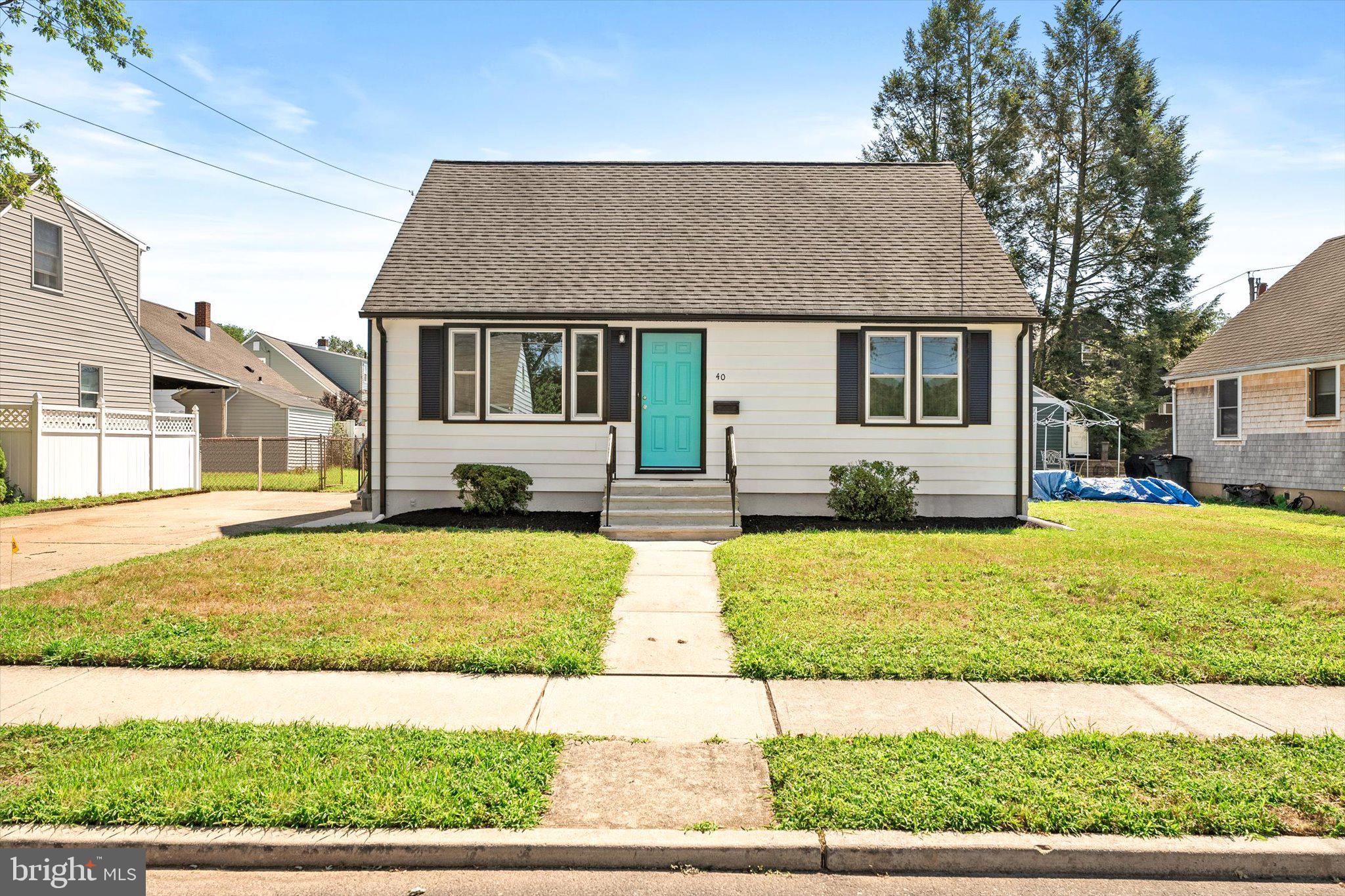 40 Unwin Drive Hamilton, NJ 08610 - Photo 2 of 26 a house view with a garden space