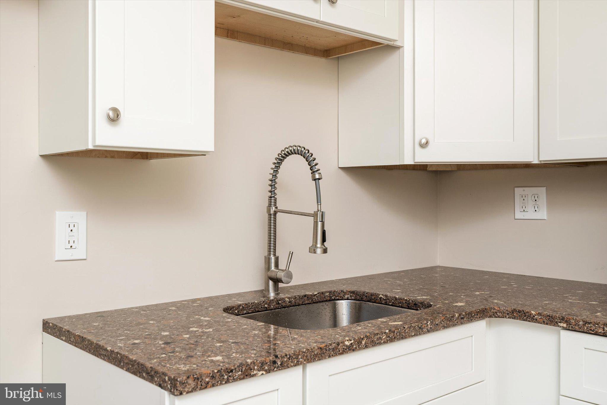 40 Unwin Drive Hamilton, NJ 08610 - Photo 10 of 26 a kitchen with granite countertop a sink and a stove