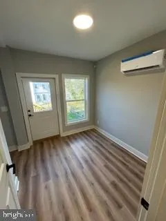 a view of staircase with railing and a chandelier