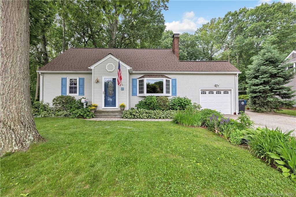 26 Franklin Road Milford, CT 06460 - Photo 1 of 1 a front view of a house with a yard and trees