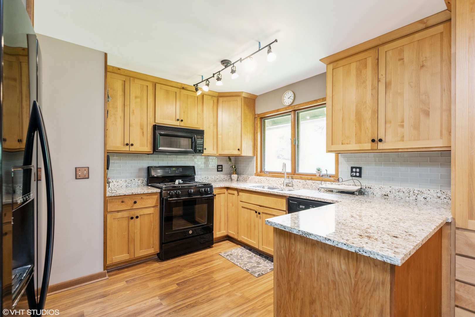 35W461 Country School Road Dundee, IL 60102 - Photo 15 of 32 a kitchen with a stove a sink and a microwave