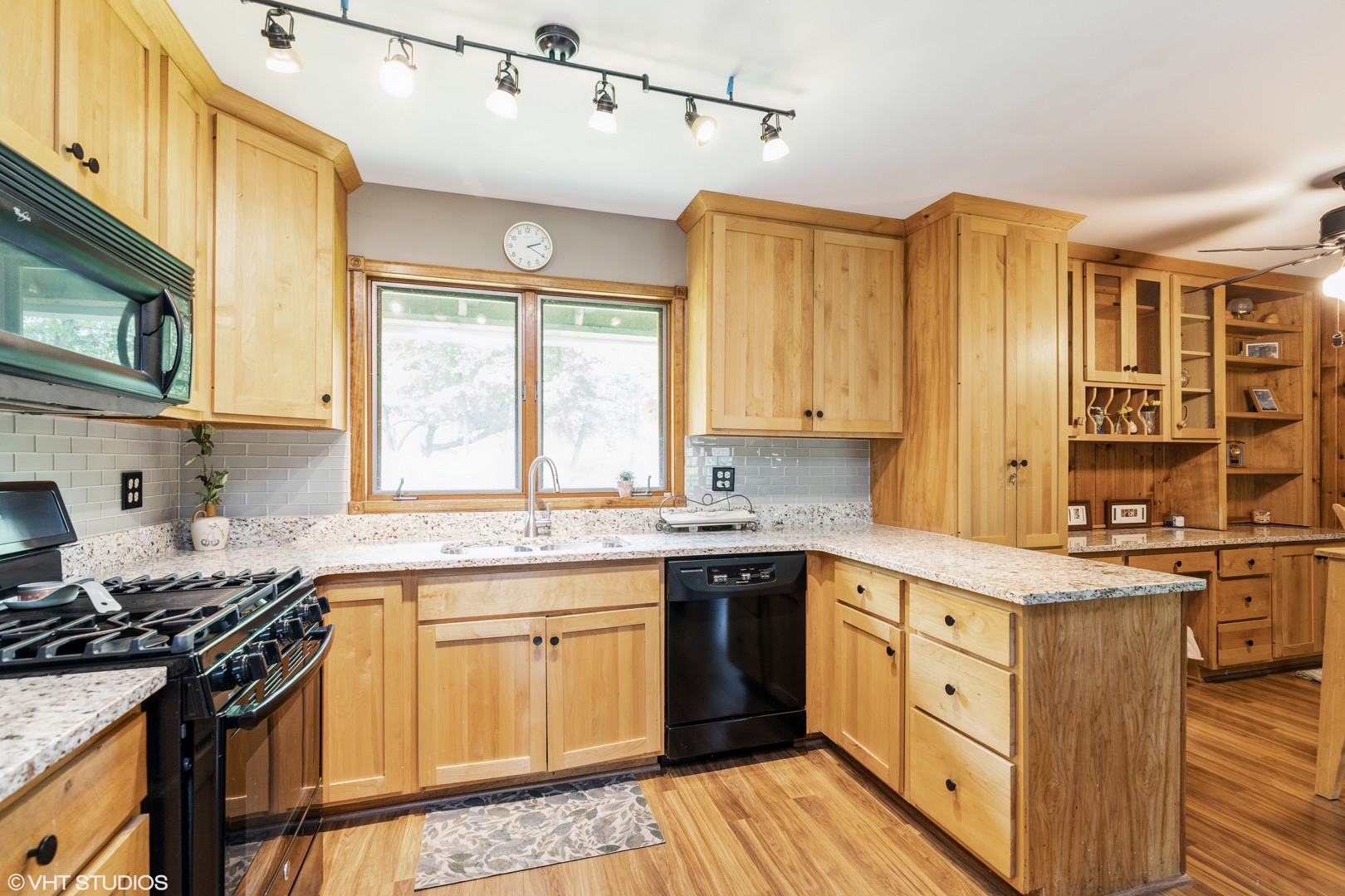 35W461 Country School Road Dundee, IL 60102 - Photo 16 of 32 a kitchen with stainless steel appliances granite countertop a sink stove and refrigerator