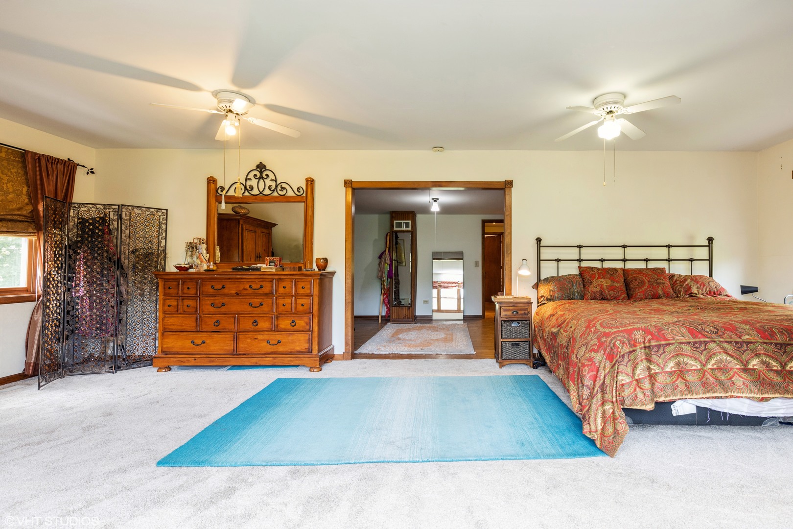 35W461 Country School Road Dundee, IL 60102 - Photo 24 of 32 a bedroom with a large bed and a chandelier