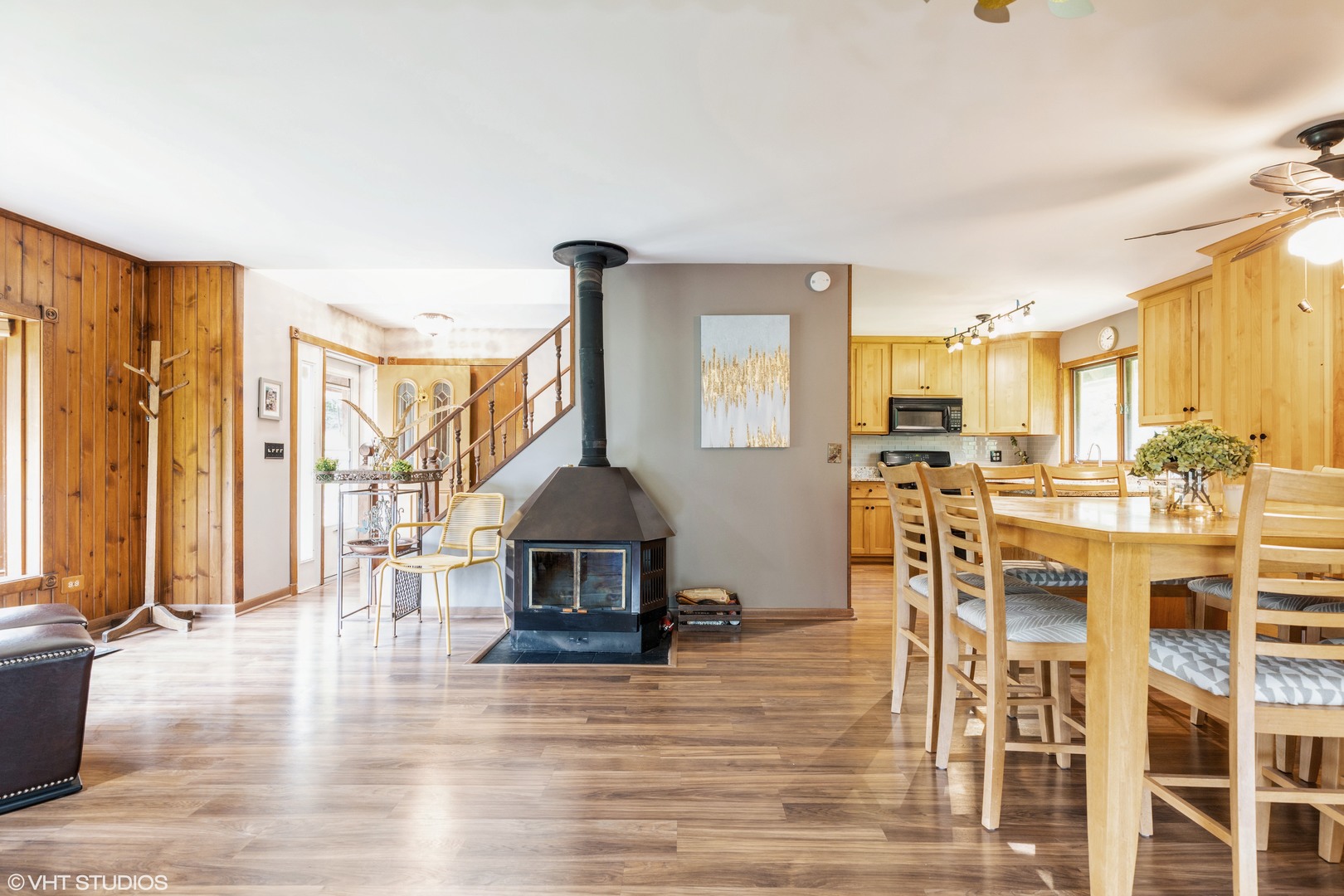 35W461 Country School Road Dundee, IL 60102 - Photo 5 of 32 a living room with furniture a wooden floor and a chandelier