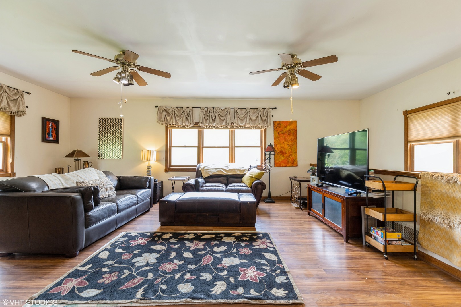 35W461 Country School Road Dundee, IL 60102 - Photo 9 of 32 a living room with furniture ceiling fan and a rug