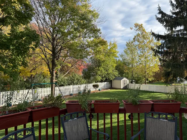 a view of yard with furniture and trees