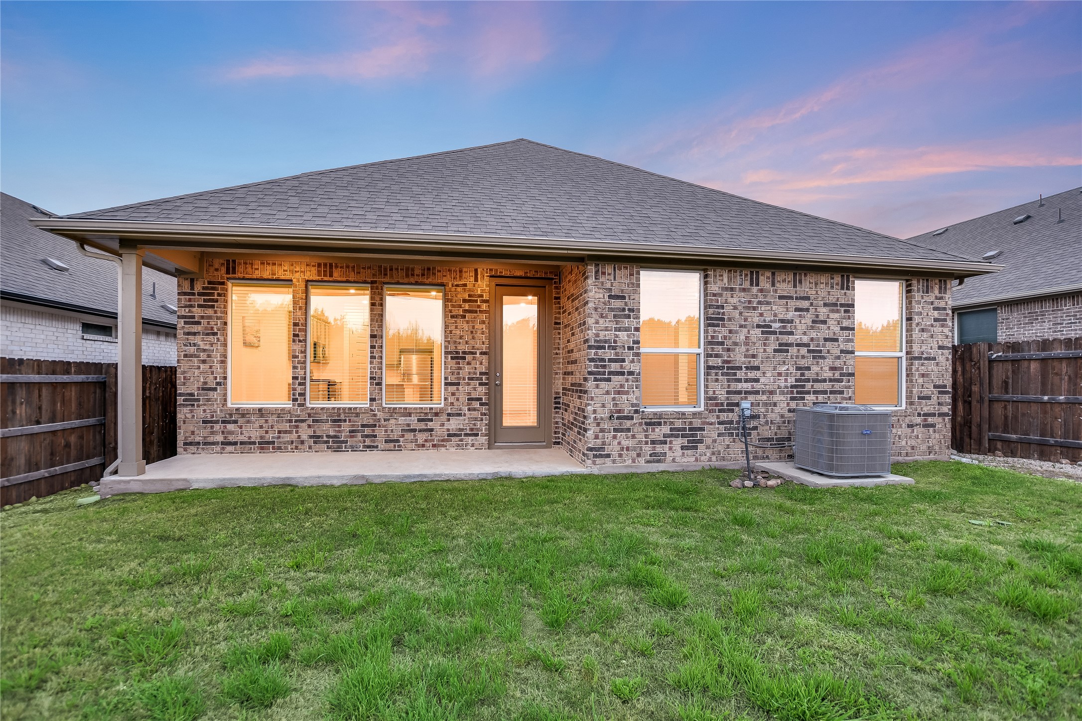 2244 Alamar Walk Leander, TX 78641 - Photo 15 of 22 a patio with table and chairs and a barbeque