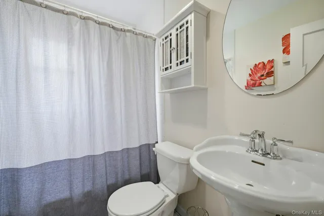 a bathroom with a toilet and a sink