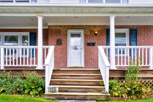 a view of a house with wooden fence