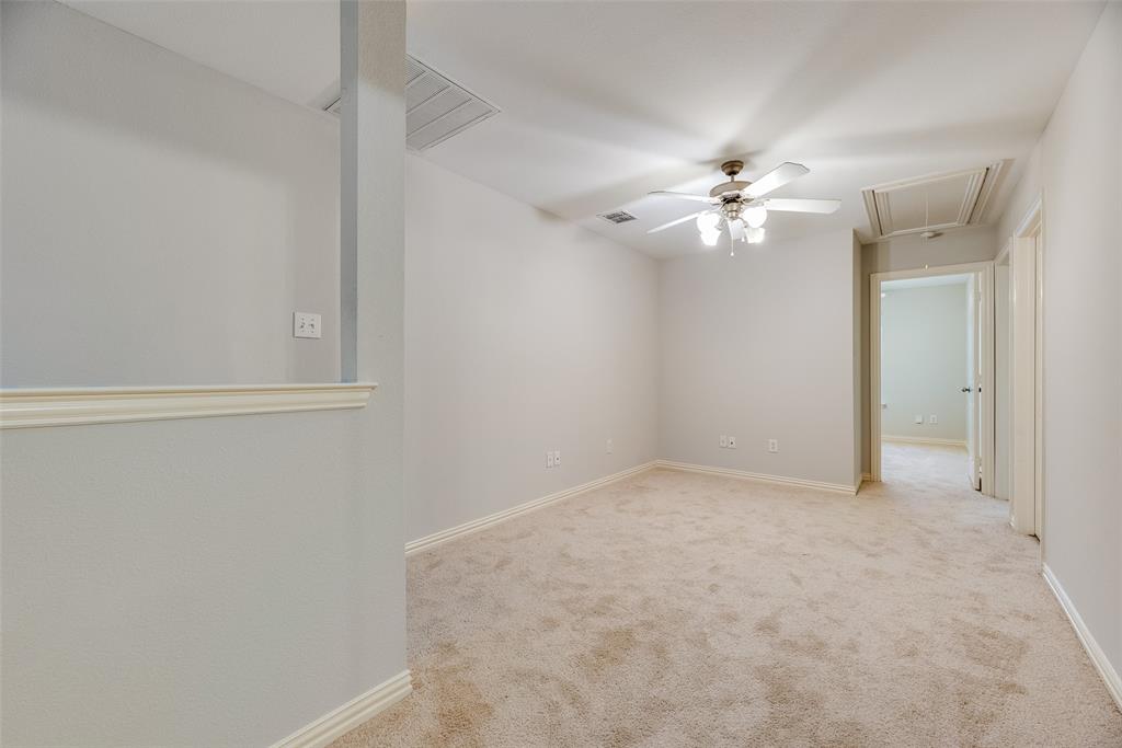 2320 Durango Ridge Drive Bedford, TX 76021 - Photo 12 of 21 an empty room with a window and a ceiling fan