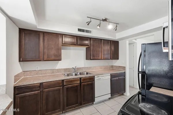 a kitchen with a refrigerator stove and microwave