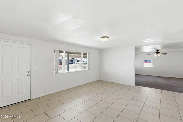 a view of an empty room and window