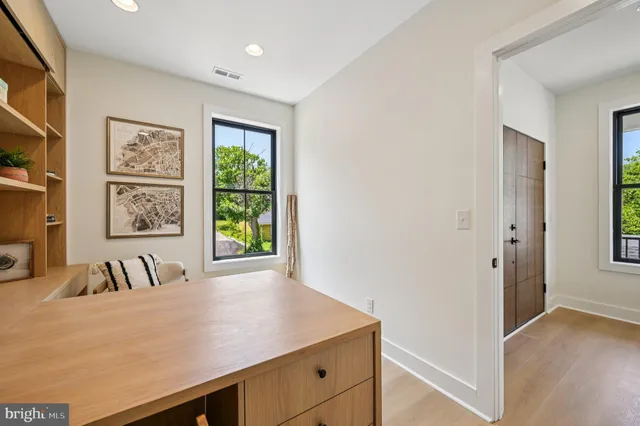 a kitchen with stainless steel appliances a stove a sink dishwasher and cabinets with wooden floor