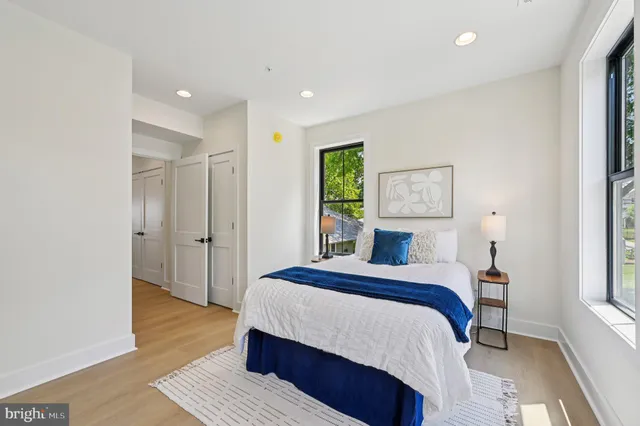 a bathroom with a double vanity sink and mirror