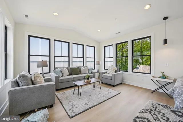 a front view of a house with a yard table and chairs