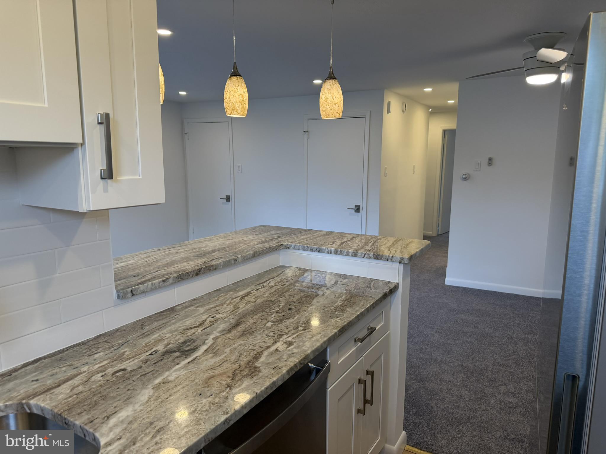 22 Windsor Road, Unit 2 Glenside, PA 19038 - Photo 16 of 29 a view of kitchen island wooden floor