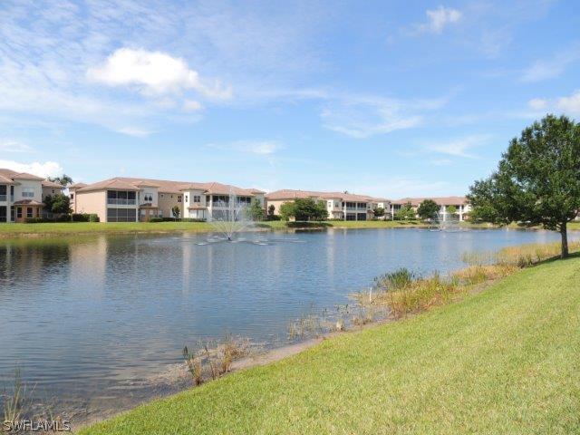 3590 Lansing Loop, Unit 201 Estero, FL 33928 - Photo 15 of 16 a view of a lake with houses