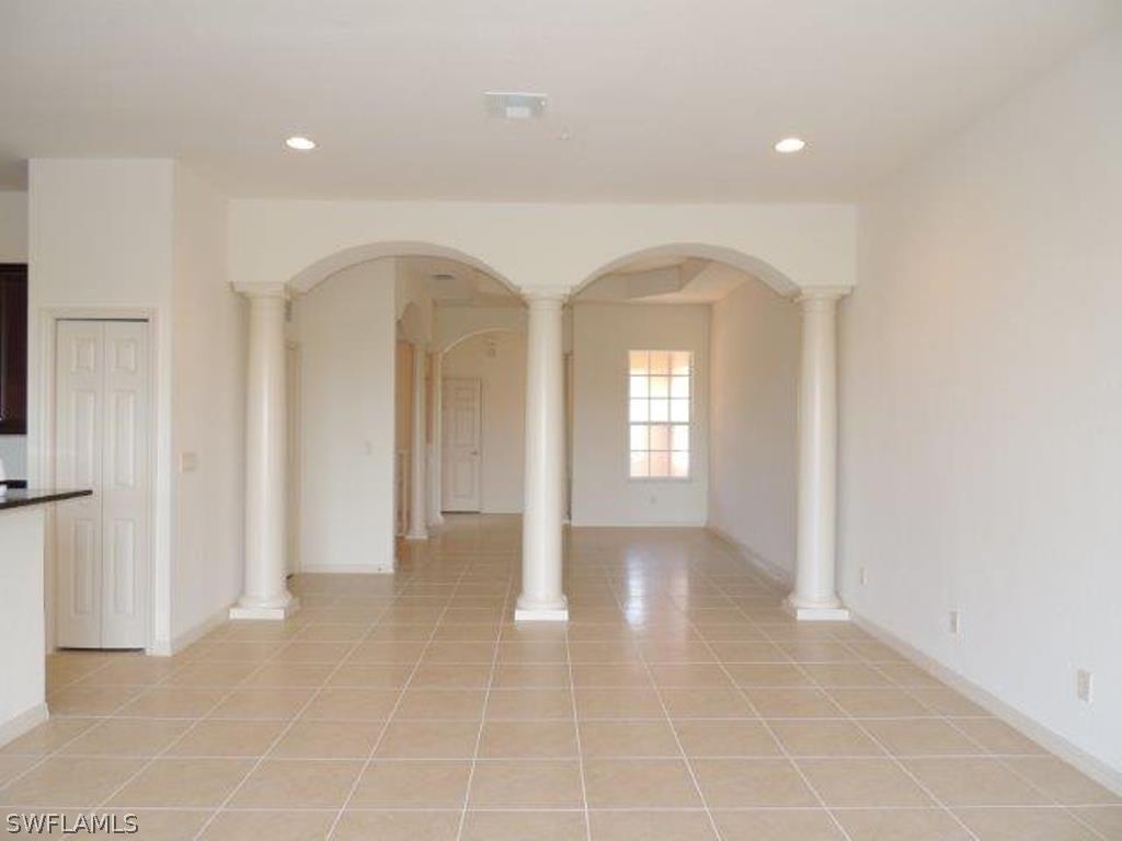 3590 Lansing Loop, Unit 201 Estero, FL 33928 - Photo 5 of 16 a view of an empty room and window