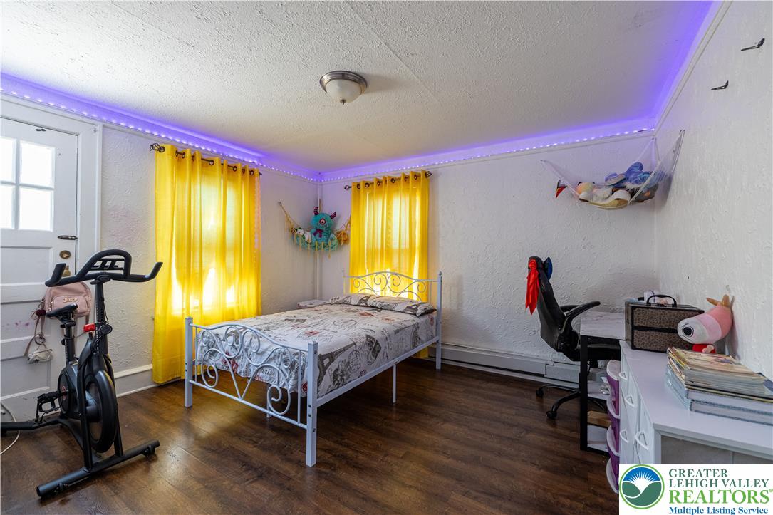 118 South 3rd Street Bangor, PA 18013 - Photo 14 of 33 This cozy bedroom features durable hardwood flooring and natural light.