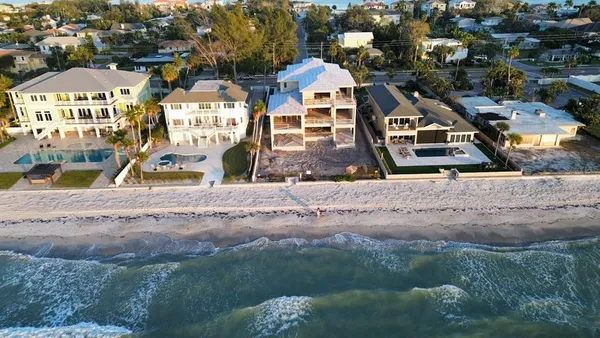 an aerial view of residential houses and outdoor space