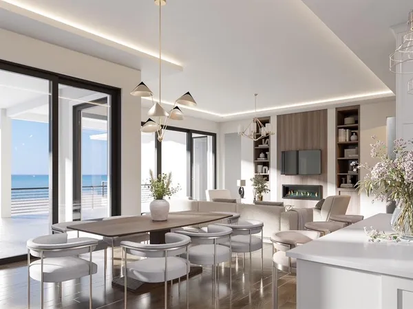 a living room with furniture and large windows