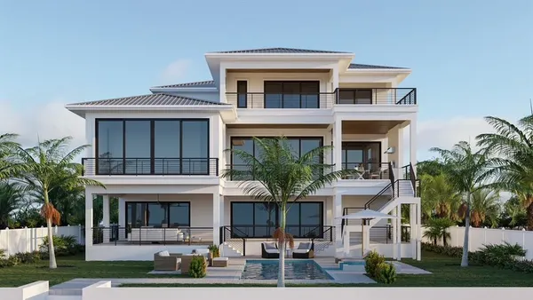 a front view of a house with garden and plants