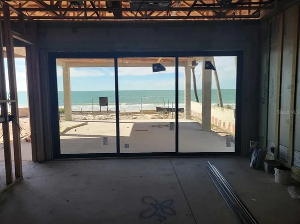 a view of an empty room and window
