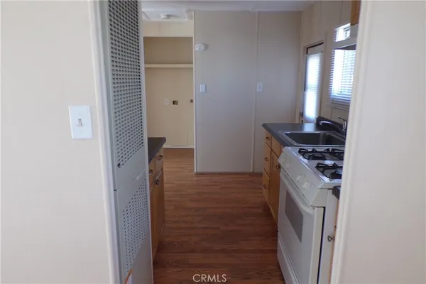 a kitchen with a refrigerator and a stove