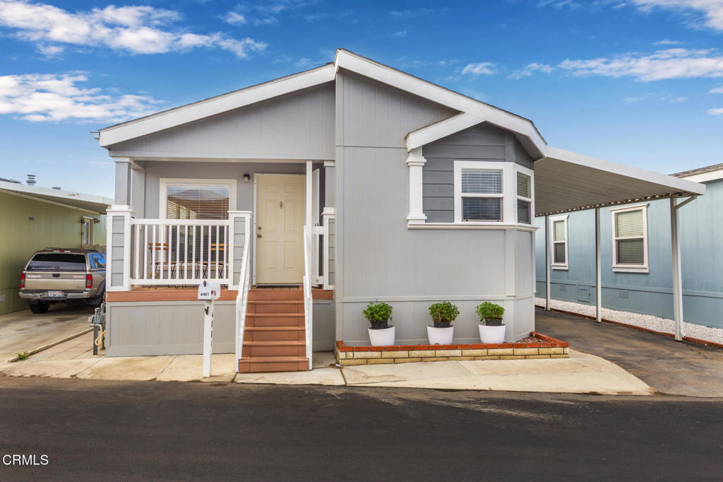 4061 Canary Lane, Unit 4061 Oxnard, CA 93033 - Photo 1 of 21 a view of a house with a yard
