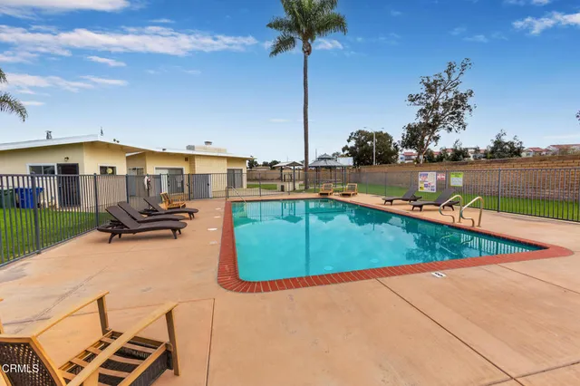 a view of a swimming pool with a lounge chairs