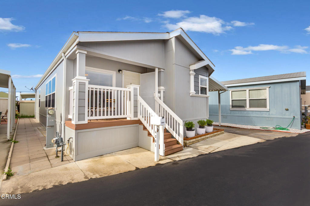 4061 Canary Lane, Unit 4061 Oxnard, CA 93033 - Photo 21 of 21 a house with trees in the background