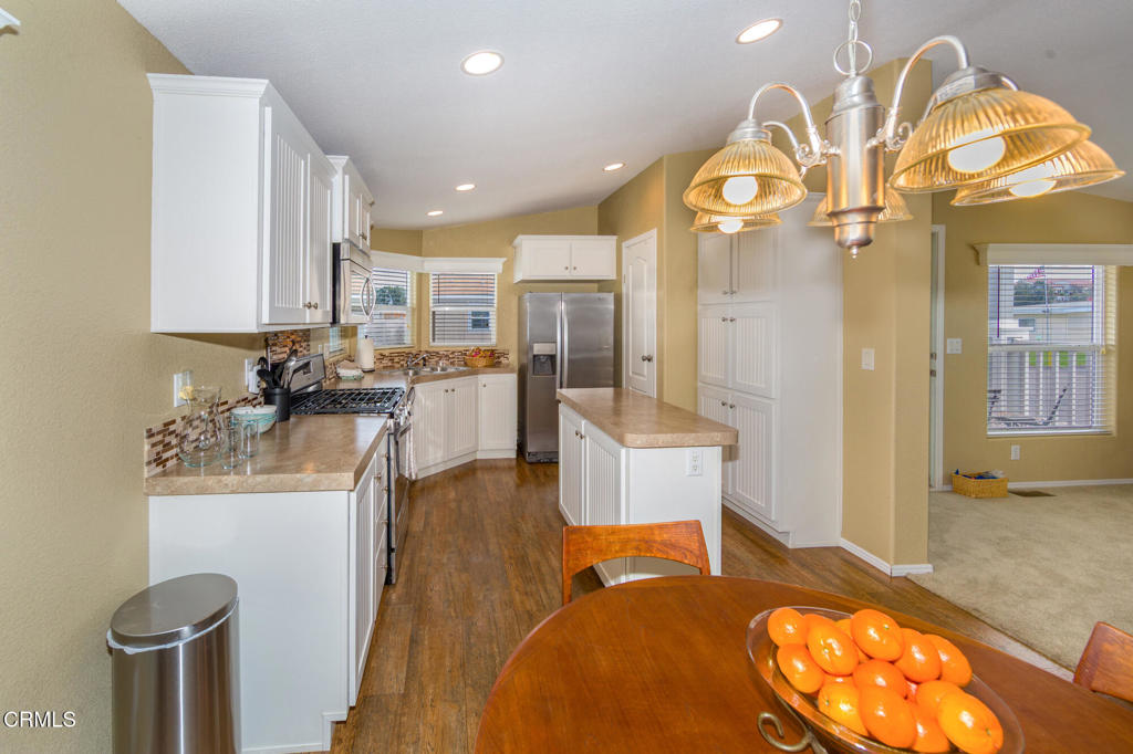 4061 Canary Lane, Unit 4061 Oxnard, CA 93033 - Photo 6 of 21 a very nice looking kitchen with granite countertop a stove and cabinets