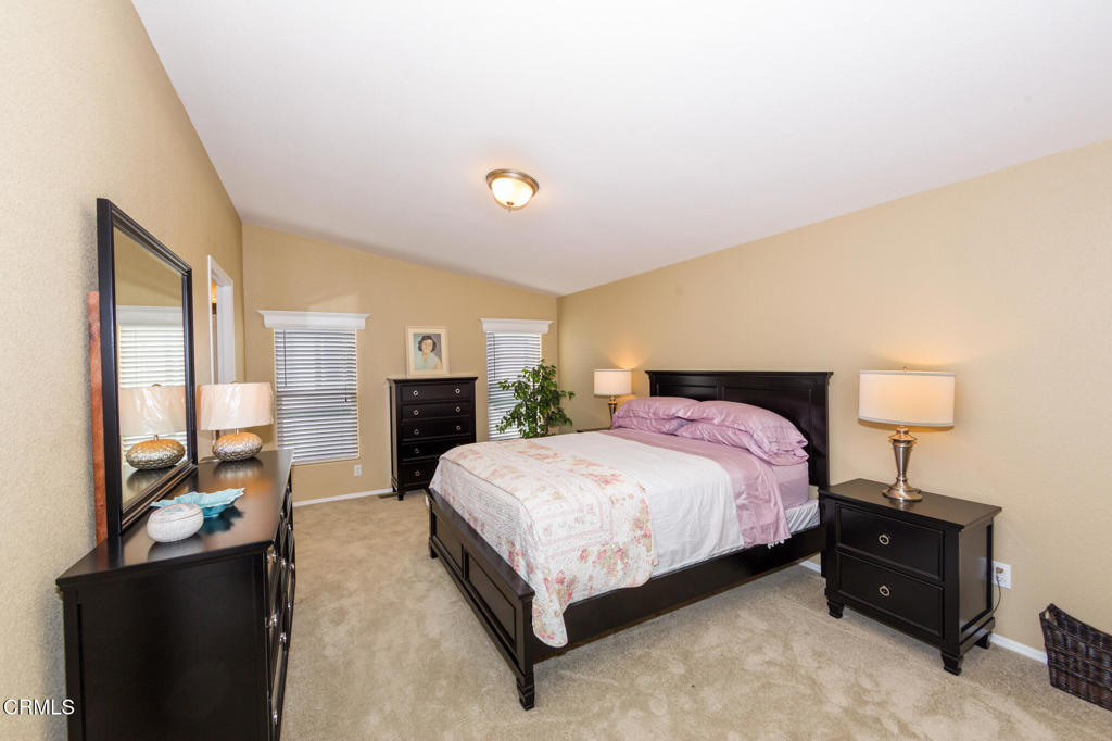 4061 Canary Lane, Unit 4061 Oxnard, CA 93033 - Photo 9 of 21 a spacious bedroom with a bed and wooden floor
