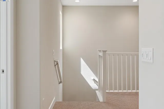 a view of a hallway with staircase