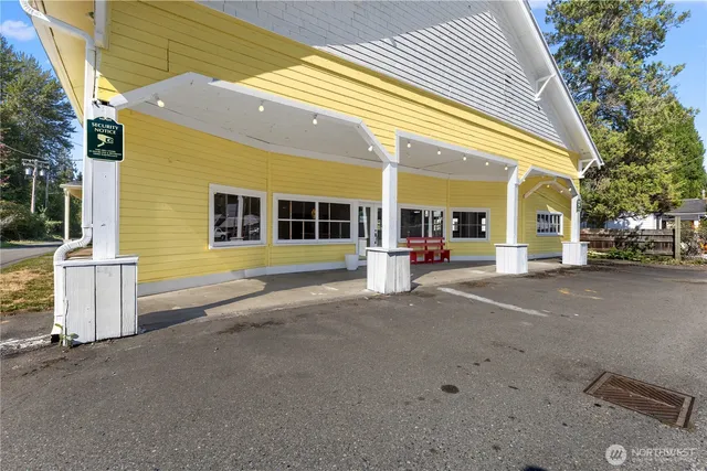 a view of a building with car parked