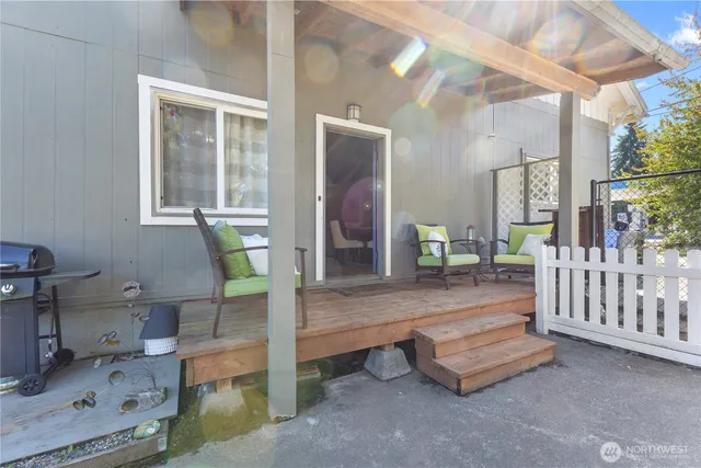 a room with fireplace table and windows