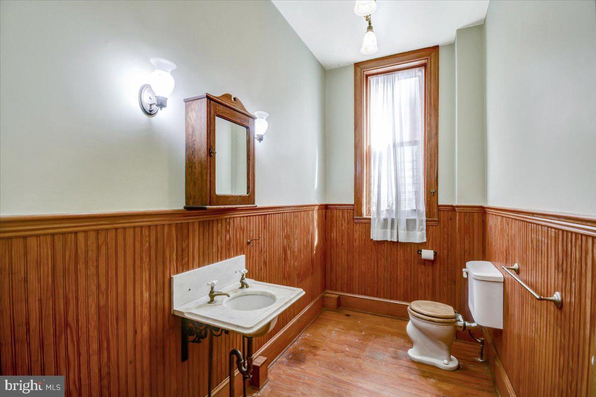 1718 Eutaw Place Baltimore, MD 21217 - Photo 21 of 65 Beadboard wainscotting, brass sink, hardwood flrs
