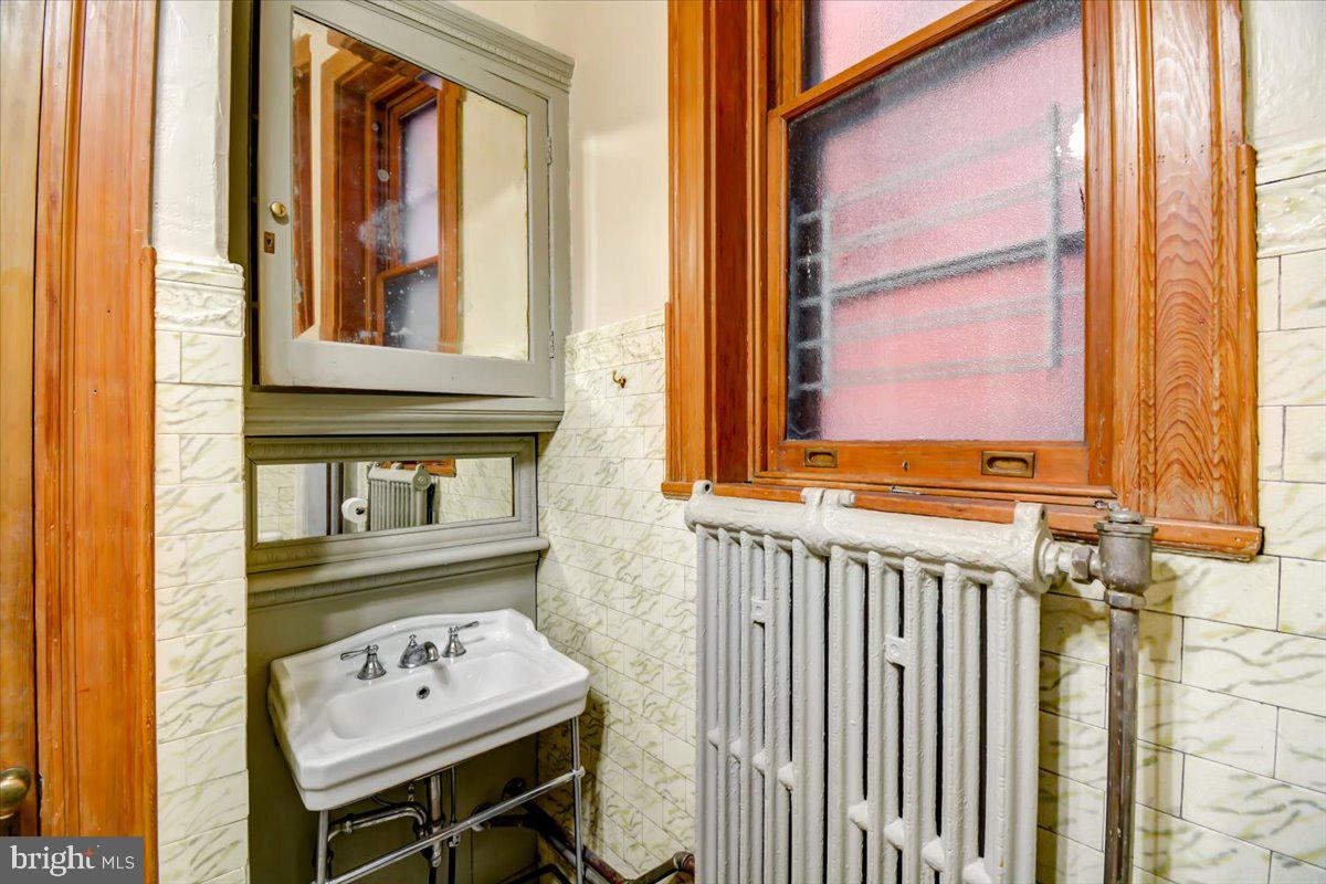 1718 Eutaw Place Baltimore, MD 21217 - Photo 23 of 65 Custom painting tiles & layers of wood molding