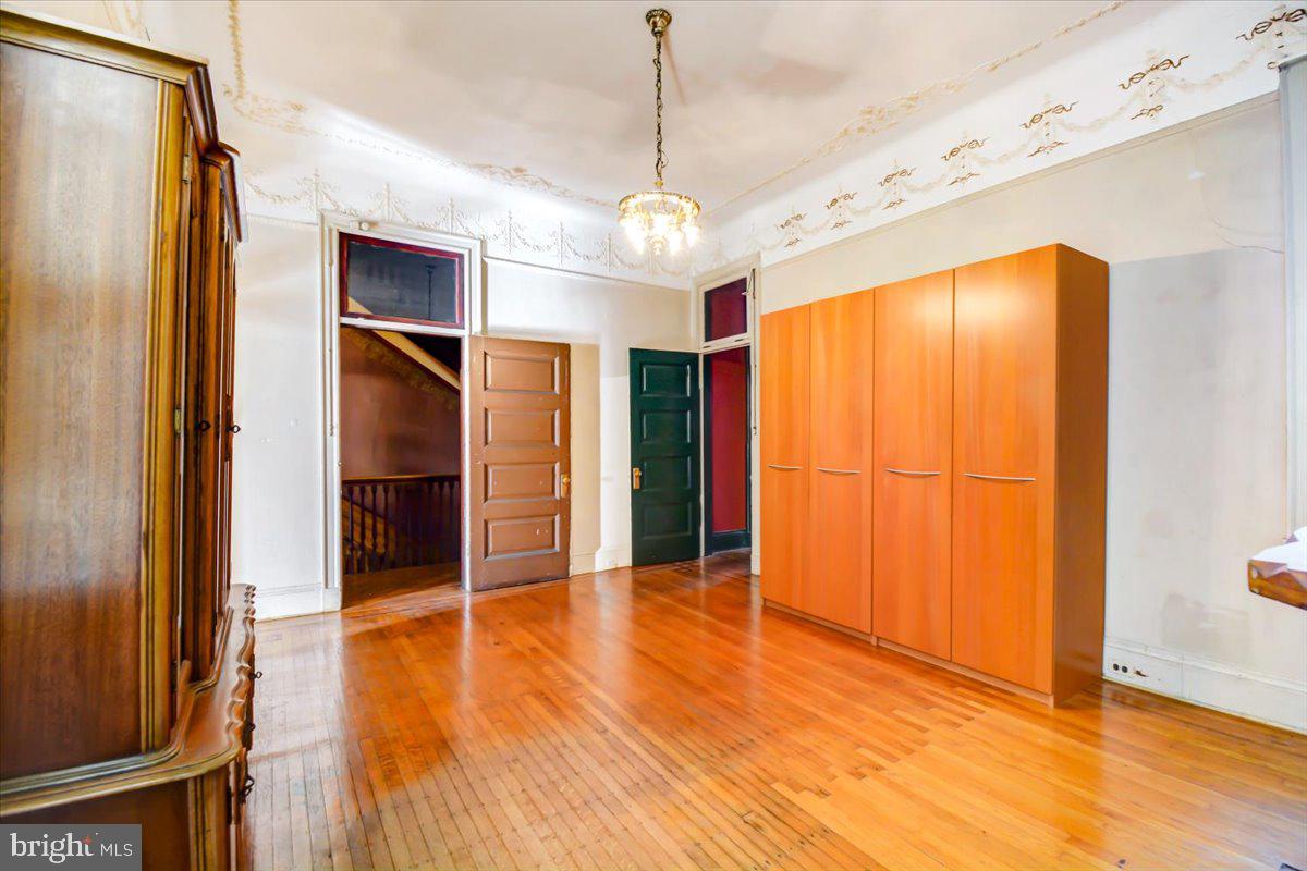 1718 Eutaw Place Baltimore, MD 21217 - Photo 32 of 65 BR3: upper 1 w/ Chandelier & hardwood (Hwd) floors