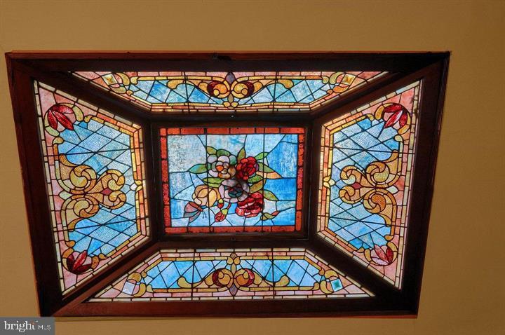 1718 Eutaw Place Baltimore, MD 21217 - Photo 40 of 65 Stained glass skylight mural above grand staircase