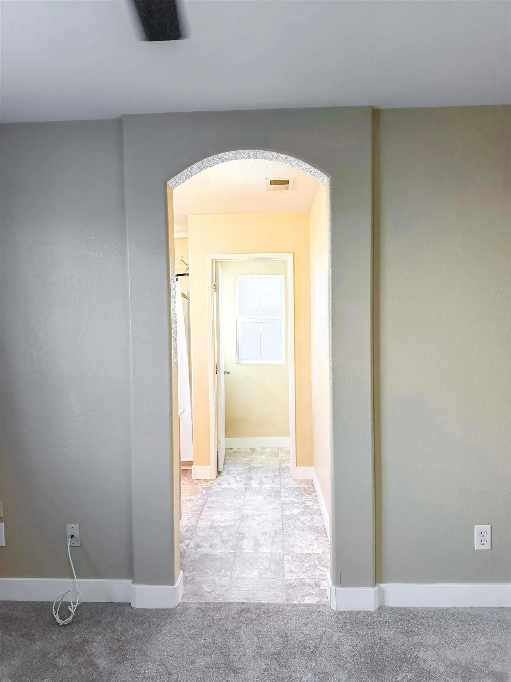1431 Trouville Lane, Unit 5 Chula Vista, CA 91913 - Photo 16 of 28 a view of a hallway with wooden floor and a bathroom