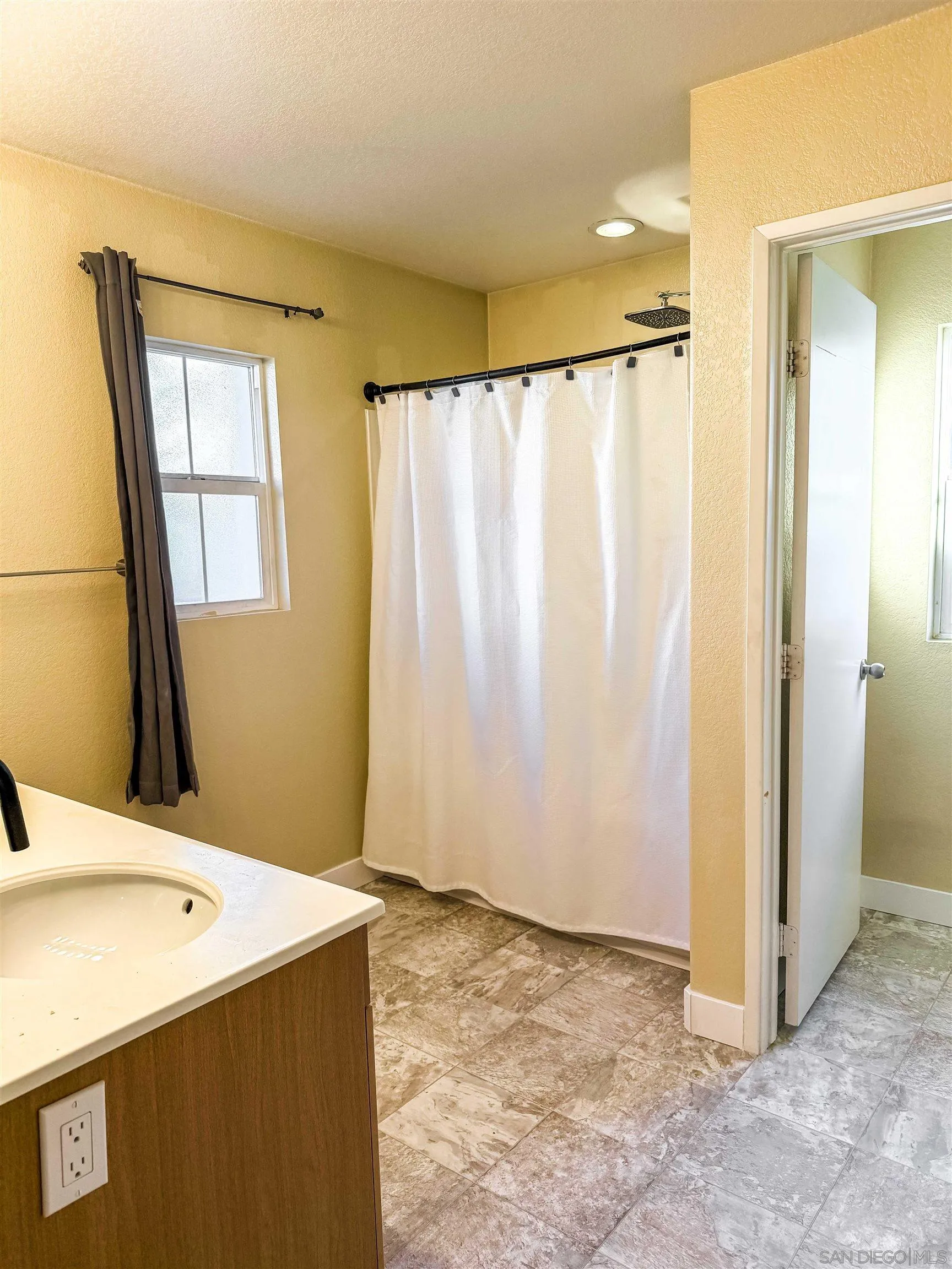 1431 Trouville Lane, Unit 5 Chula Vista, CA 91913 - Photo 17 of 28 a view of a bathroom with tub and sink