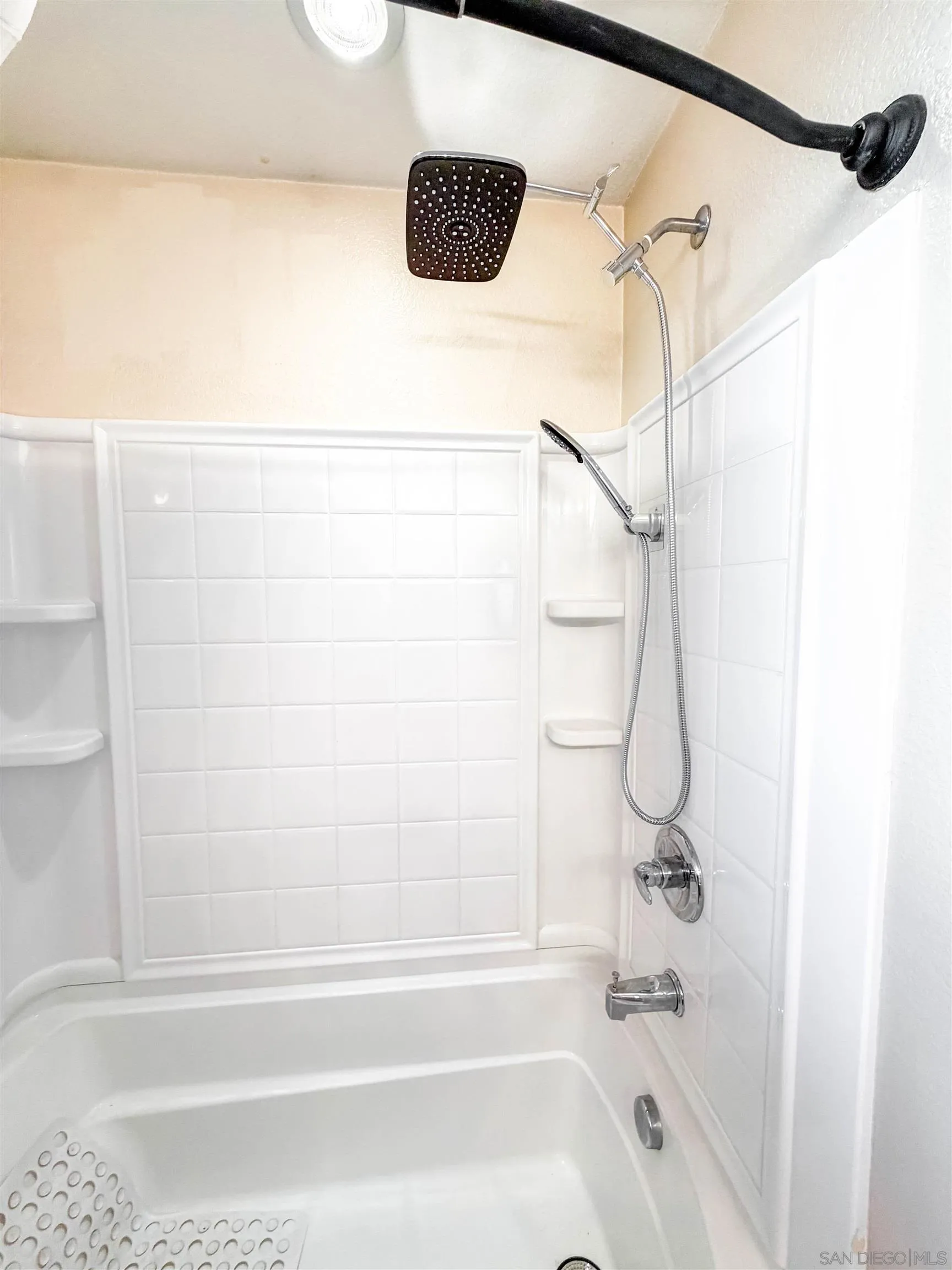 1431 Trouville Lane, Unit 5 Chula Vista, CA 91913 - Photo 25 of 28 a bathroom with a shower and a bath tub