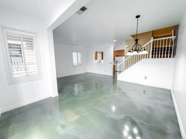 a view of a hallway with stairs